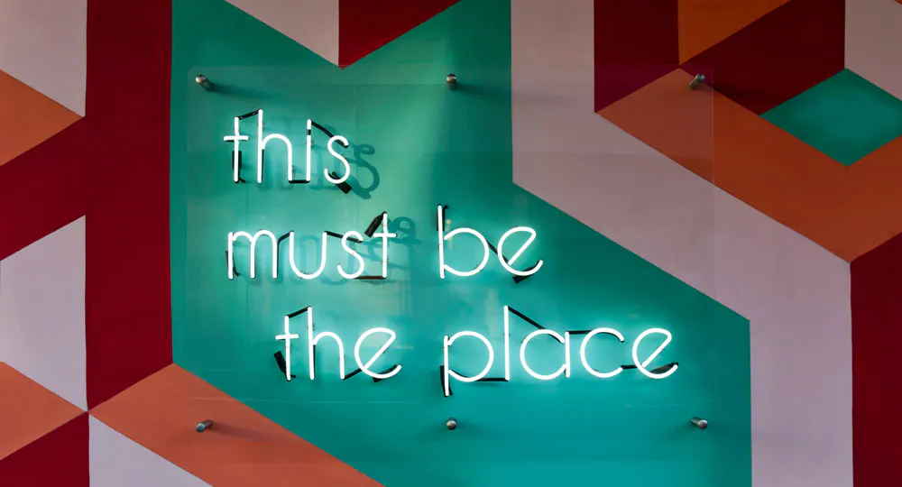 A sign that says 'this must be the place' - Coleman Training Vacancy page image