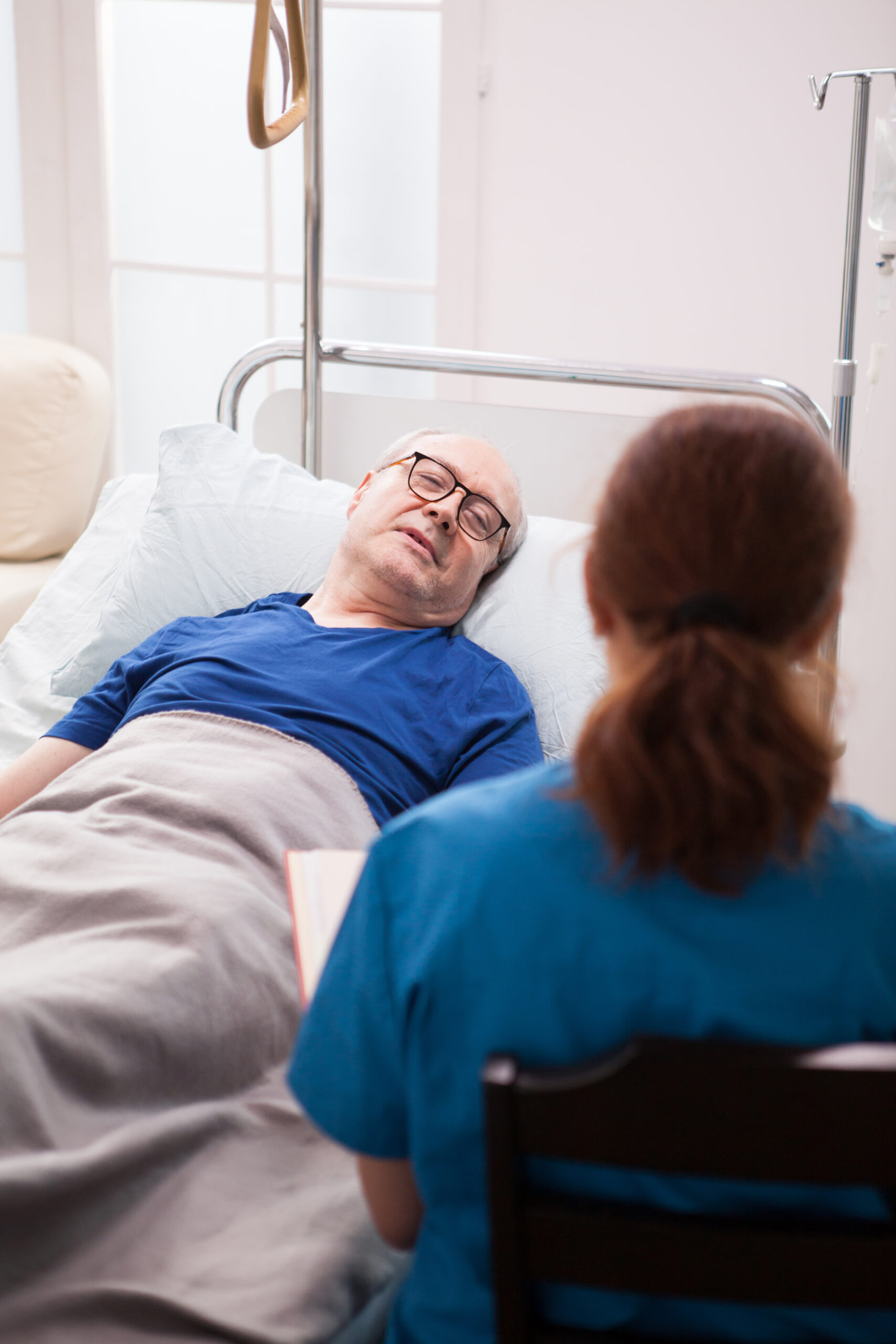 Elderly person in bed with catheter in place - image for Catheter Care Training Course