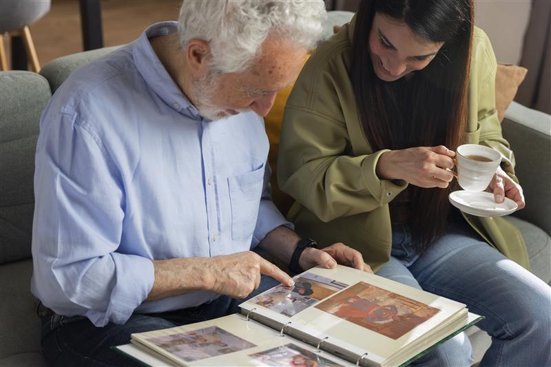 people looking picture albums